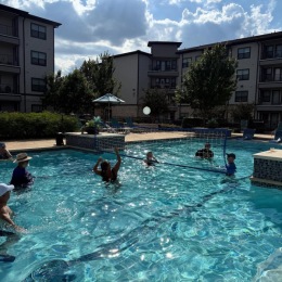 Pool Volleyball & Social Hour Recap!  people playing volleyball in a pool