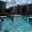 people playing volleyball in a pool