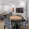 a game room with tables and chairs