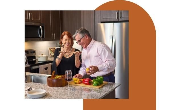a man and a woman cooking in a kitchen