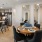 a kitchen next to a dining area with a dining table