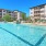 a swimming pool in front of a building