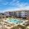 a large building with a pool in front of it