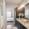 a bathroom with a large mirror and glass shower stall
