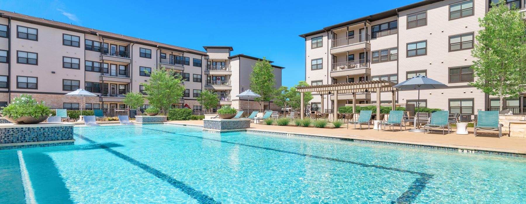 a swimming pool in front of a building