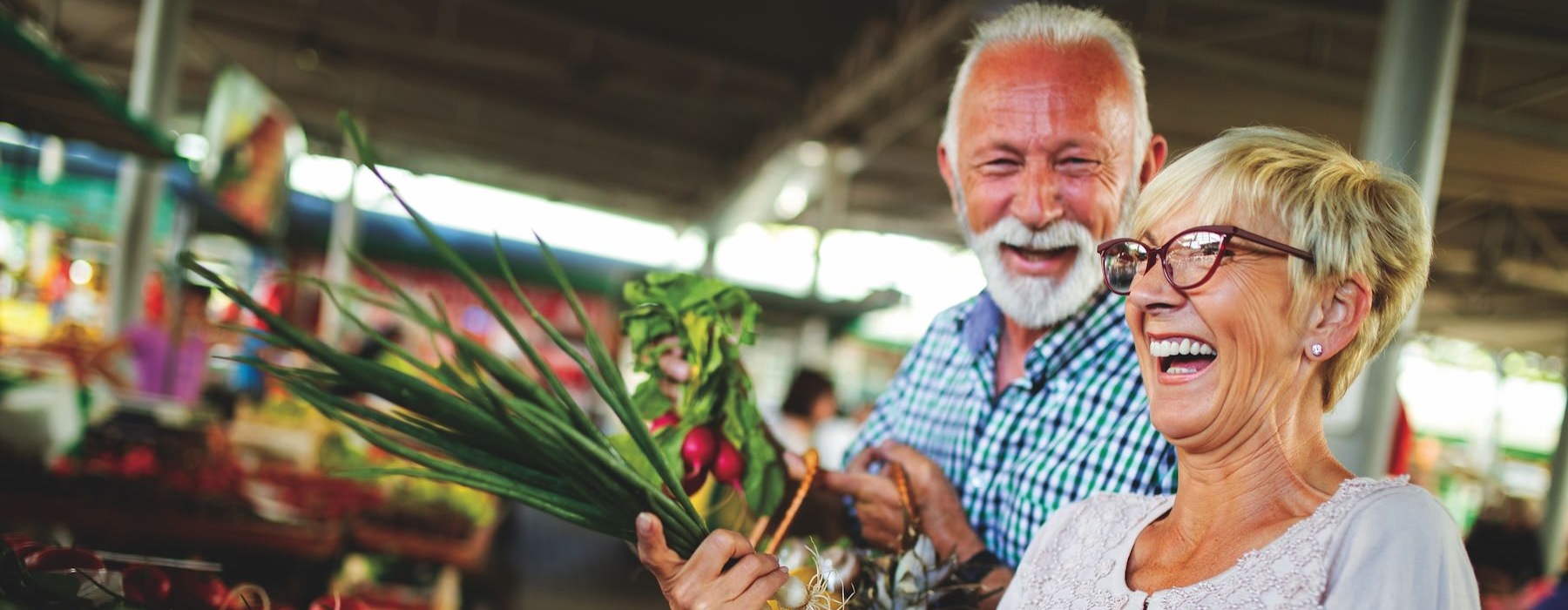 Find your perfect fit at Solea Alamo Ranch a man and woman holding a basket of vegetables