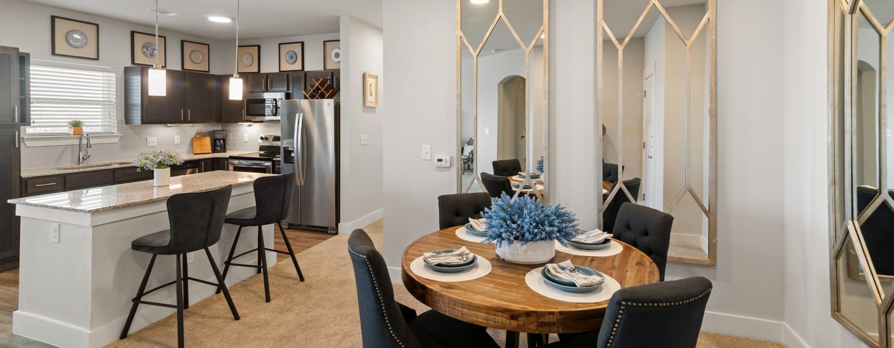 Gorgeous living areas to entertain and enjoy a kitchen next to a dining area with a dining table